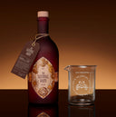 The Sentinel Rum Bottle Next to Sentinel Rum Glass - Front View